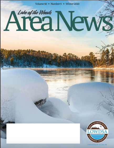 Winter snowbanks with open water of a lake