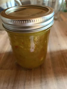 Sealed jar of green tomato and cucumber relish