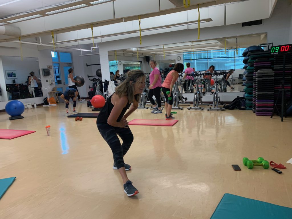 Kelli Saunders doing cools down calf stretches.