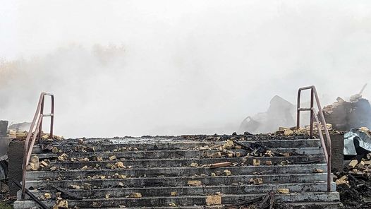 Concrete steps with smoke billowing in the background