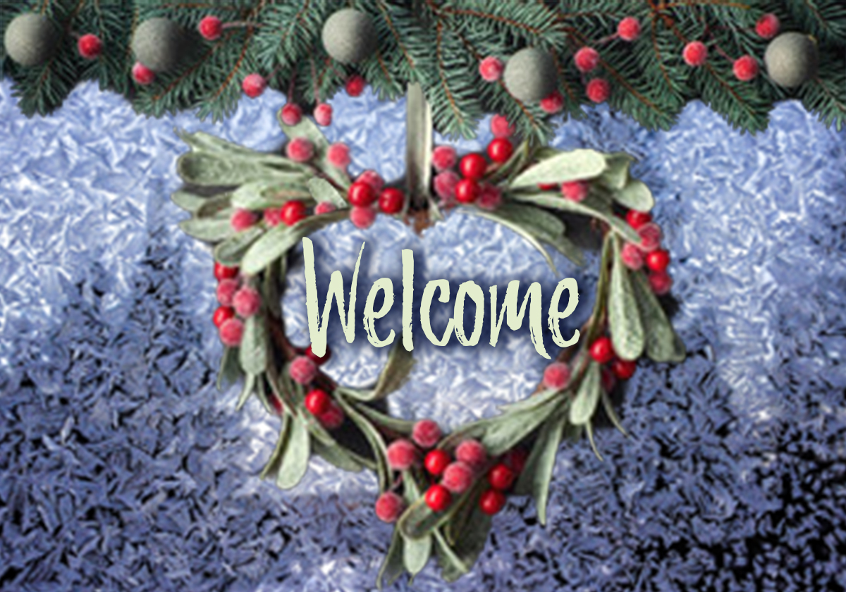 A heart shaped wreath with red berries on a snowy background with the words Welcome in the middle.